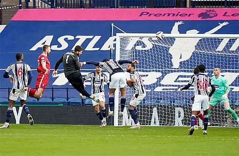 Keeper Alisson Becker heads Liverpool to last-gasp victory