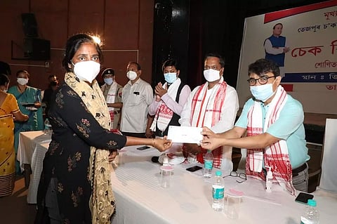 Minister Ashok Singhal Distributed Cheques to Businessmen Affected in Tezpur Chowk Bazaar Fire