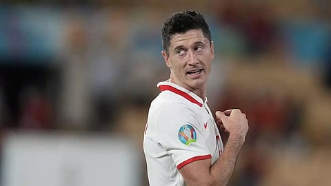 Poland's Robert Lewandowski looks to find a way past Sweden