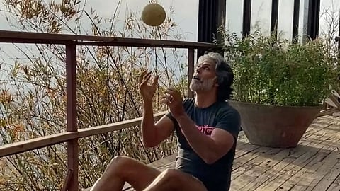 Milind Soman works out with muskmelon as weight