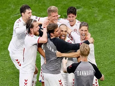 Dolberg brace powers Denmark past Wales into quarters