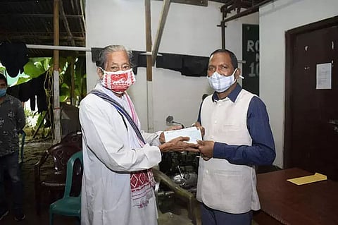 Minister Sanjoy Kishan hands over cheques to eight cancer patients in Tinsukia district