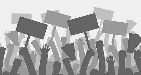 Protest rally against price hike at Chowkidinghi intersection in Dibrugarh