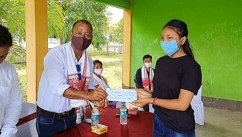 Distribution of scholarship cheques to meritorious students in Dudhnoi