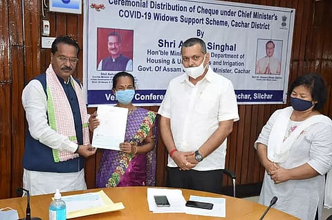 Cachar Guardian Minister Koushik Rai hands over cheques to COVID widows