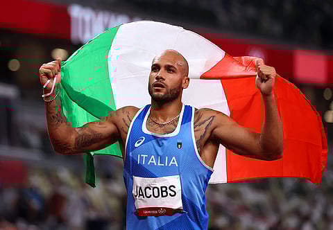 Italy's Jacobs takes stunning 100 m gold