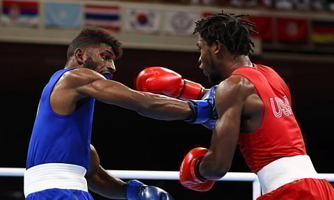 Andy Cruz, Harrington win lightweight gold