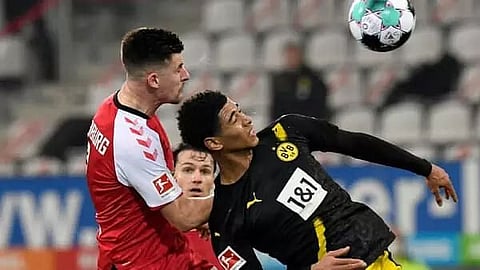 Freiburg pull off gritty win over Dortmund as Wolfsburg go top