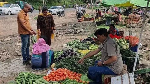 Picture Of IAS Officer Selling Veggies In Roadside Stall Goes Viral On Social Media