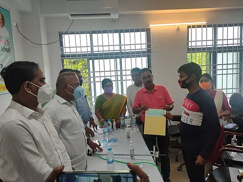 Minister Parimal Suklabaidya distributes cheques to next of kin of COVID victims