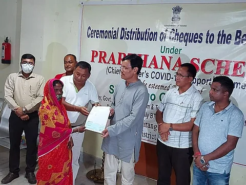 Minister Urkhao Gwra Brahma distributes cheques under 'Prarthana' scheme