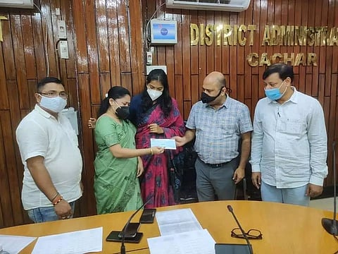 Cheques distributed to beneficiaries under CM's Widows Support Scheme, Prarthana Scheme in Cachar