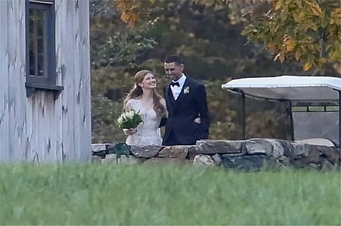 Bill, Melinda Gates walk daughter down the aisle