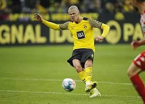 Haaland scores twice on return to send Dortmund on top