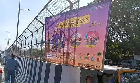 Guwahati Municipal Corporation removes illegal banner from flyover of Falcon Festival 2021