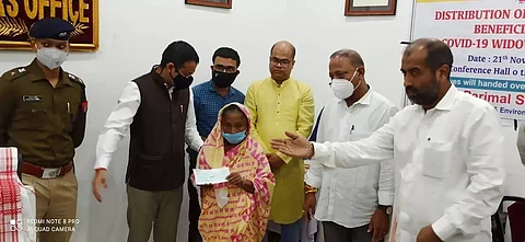 Minister Parimal Suklabaidya handed over cheques to COVID widows