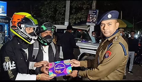 Bikers wearing helmets get surprise gifts from police in Golaghat district