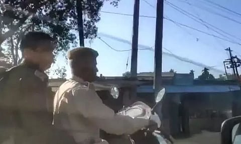 Viral Video | Bike Borne Cops in Diphu Asked "Where Are Your Helmets"? Replies "Amak Helmet Nalage"