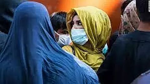 Posters across Kabul reminding women to wear hijab