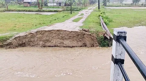 Overflowing water of Dropang breaches Lakhipur Maghnowa Road