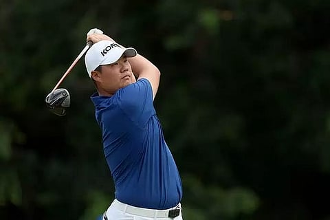 Korea's Im grabs lead as Woods hogs spotlight