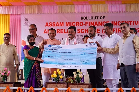 Minister Ranjit Kumar Dass distributes cheques under micro-finance scheme