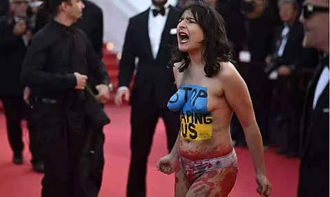 Woman protesting Ukraine sexual violence removed from Cannes red carpet