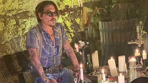 Johnny Depp grabs a pint and fish and chips to celebrate trial victory