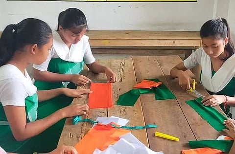 Kasturba Gandhi Balika Vidhyalaya students preparing National Flags in Kokrajhar district