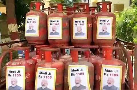 Telangana Rashtra Samithi hits back at FM with PM's pictures on LPG cylinders