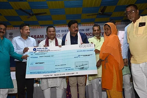 Minister Ranjit Kumar Dass distributes cheques at Dhubri District Library Auditorium