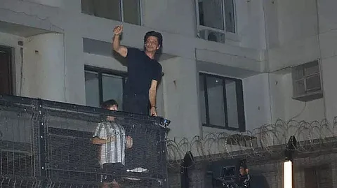 Bollywood superstar SRK's son AbRam joins him as he greets hordes of fans gathered outside Mannat for birthday
