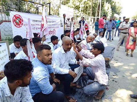 All Assam Students' Union members tonsure heads to protest delay in BVFCL's fourth unit