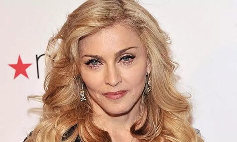 Queen of pop and American singer Madonna goes topless again after warning trolls