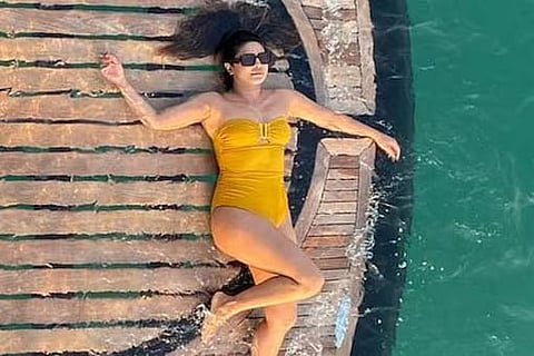 Bollywood actress Priyanka Chopra turns head in yellow swimsuit