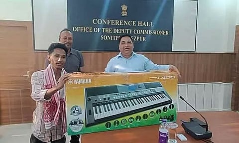 Tezpur: DC Deba Kumar Mishra handed over synthesizer keyboard to Sonitpur's Dipak Boro