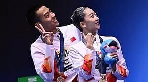 China’s Cheng, Shi win mixed duet free gold at swimming worlds