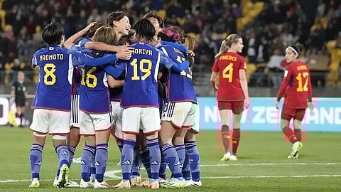 Japan, Spain march into quarters