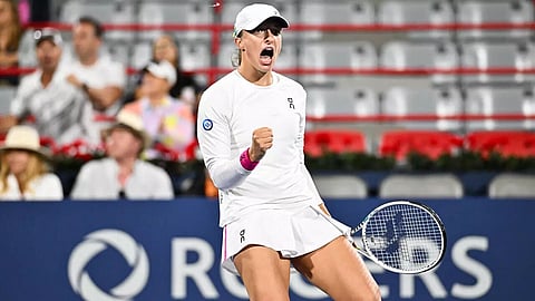 Swiatek holds off Collins to line up Montreal semifinal with Pegula