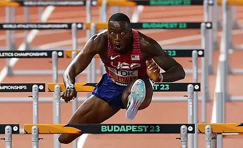 American Holloway wins third straight world 110m hurdles title