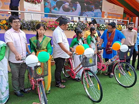 Chief Executive Member of BTC, Pramod Boro distributes bicycles to students in Kokrajhar
