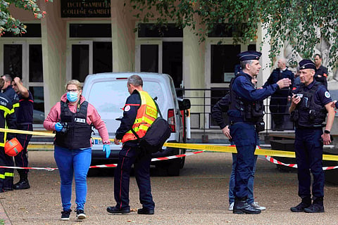 France raises security alert after an assailant fatally stabbed a teacher and injured three other