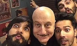 Veteran actor Anupam Kher is reminded of ‘Padosan’ as he poses with Varun, Ranveer, Arjun