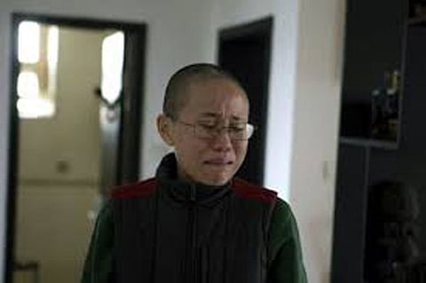 China dismisses global plea to free late dissident’s widow