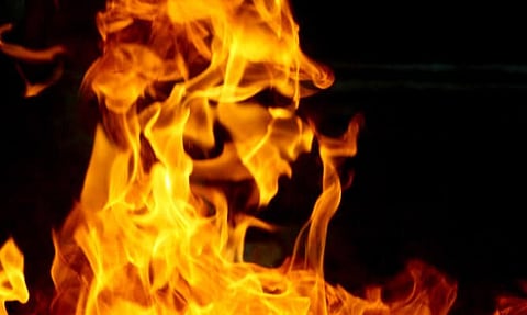 Man allegedly sets wife ablaze