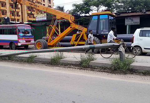 Power pole lying abandoned for years at NH-37 near Guwahati