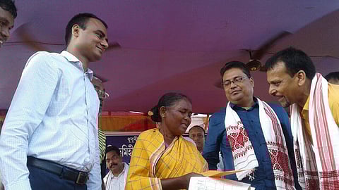 Power Minister lays foundation stone of roads, distributes land pattas