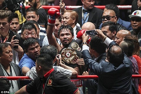 Pacquiao wins welterweight title in TKO victory