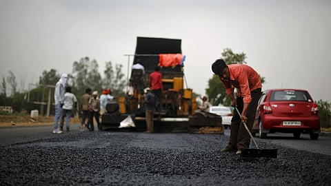 Parliamentary Secretary Gojen Gadi undertakes road repair work