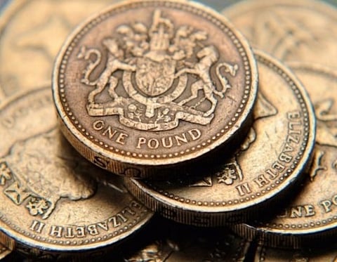 British pound falls lower against dollar, euro